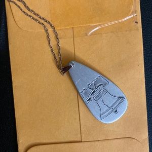 Necklace with bell pendant